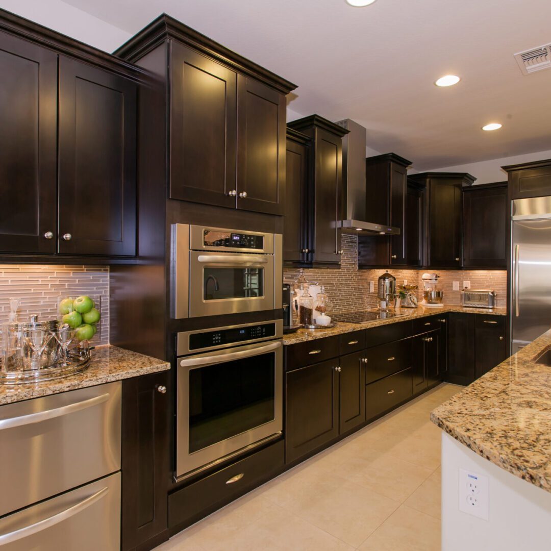 Luxury Domestic Kitchen Modern kitchen with dark cabinets and appliances.